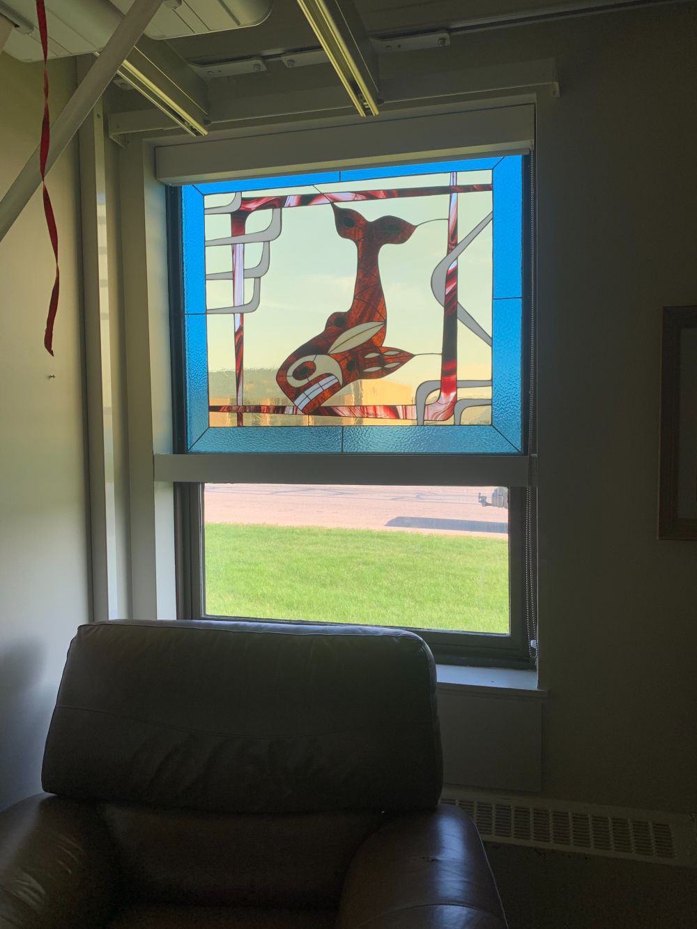 Abstract whale in stained glass window in Palliative Care Unit, Rocky Hospital